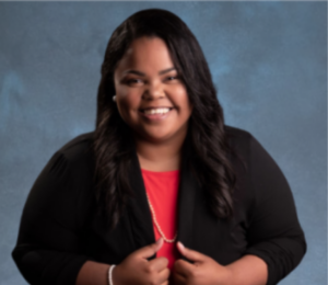 Professional portrait of ATN Board Member Tori Mabry smiling in business attire against a blue background.