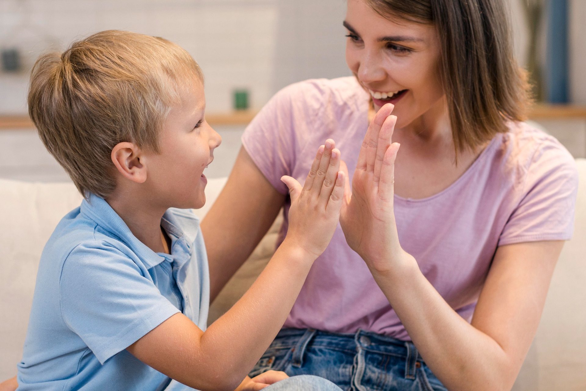 portrait-adorable-son-playing-with-mom